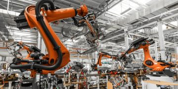 Robotics Technology in Automated Manufacturing: Business Applications and Impact